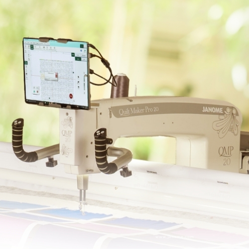 Quilting machine with attached tablet display.