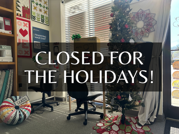Quilts Like Crazy storefront with closed for the holidays sign
