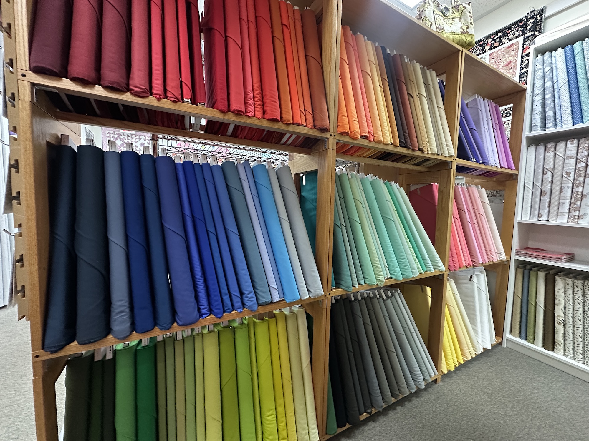 Colorful fabric bolts with moda bella Solids